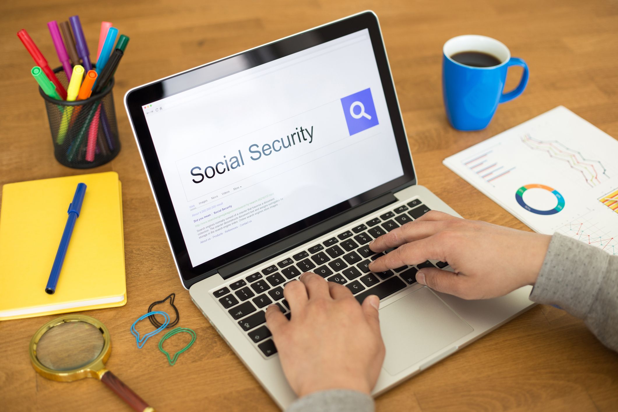 Person securely reviewing an official benefits application status on a laptop