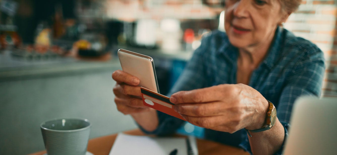 Person reviewing an electronic benefit deposit on a mobile banking screen